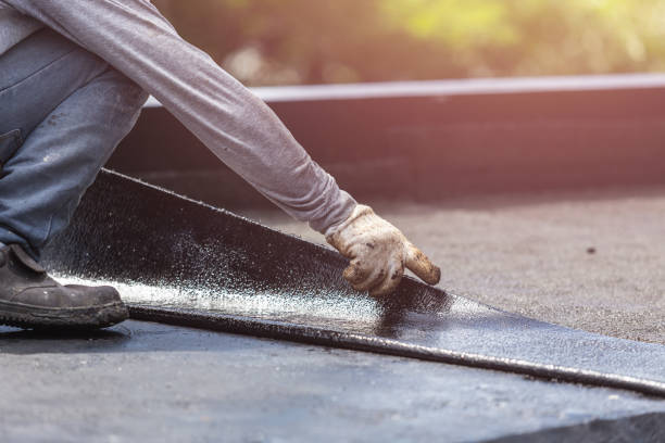 Professional Waterproofing technician working in Burt, MI